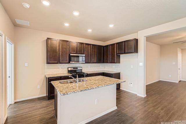 2066 Chelsea, New Braunfels, TX 78130 - kitchen with dark wood-style floors, dark brown cabinets, appliances with stainless steel finishes, and a sink