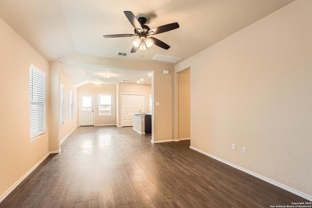 2066 Chelsea, New Braunfels, TX 78130 - unfurnished living room with dark wood-style floors, visible vents, baseboards, and ceiling fan