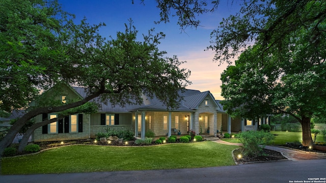 1626 Cordillera Trce, Boerne, TX 78006 - view of front of property with metal roof, stone siding, a front yard, and covered porch