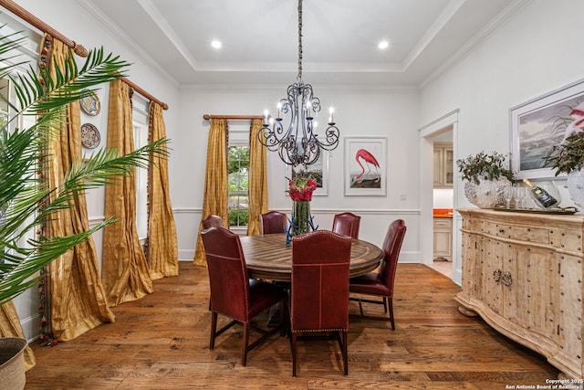 1626 Cordillera Trce, Boerne, TX 78006 - dining space with crown molding, a notable chandelier, a tray ceiling, and wood finished floors