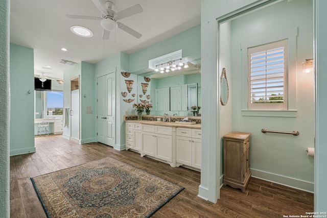 1626 Cordillera Trce, Boerne, TX 78006 - bathroom with baseboards, a ceiling fan, wood finished floors, and a wealth of natural light