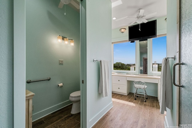 1626 Cordillera Trce, Boerne, TX 78006 - bathroom with ceiling fan, toilet, wood finished floors, and baseboards
