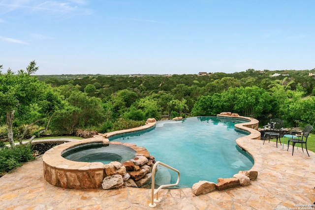 1626 Cordillera Trce, Boerne, TX 78006 - view of pool with a forest view, a patio area, and a pool with connected hot tub