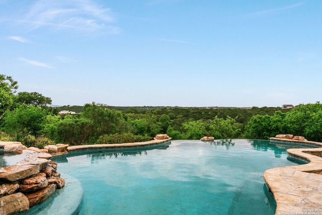 1626 Cordillera Trce, Boerne, TX 78006 - pool featuring a wooded view