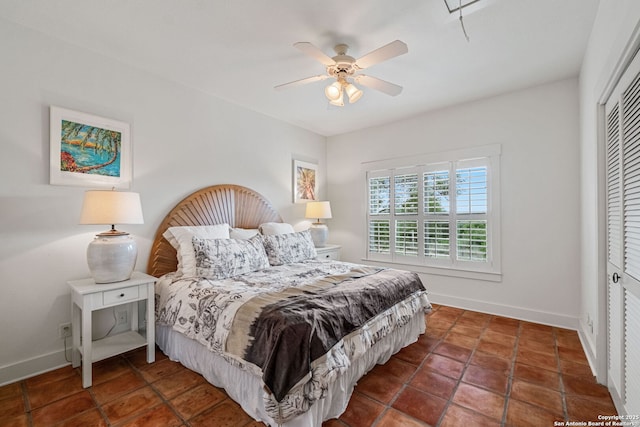 1626 Cordillera Trce, Boerne, TX 78006 - tiled bedroom featuring a closet, baseboards, and ceiling fan