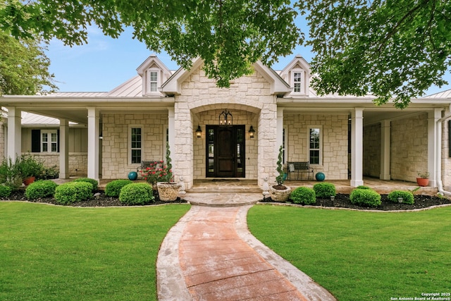 1626 Cordillera Trce, Boerne, TX 78006 - view of front facade with stone siding, a front lawn, and covered porch