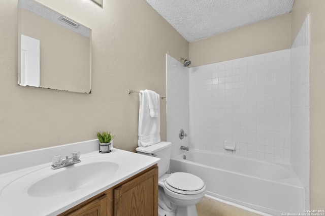 bathroom with shower / bathing tub combination, a textured ceiling, vanity, tile patterned floors, and toilet