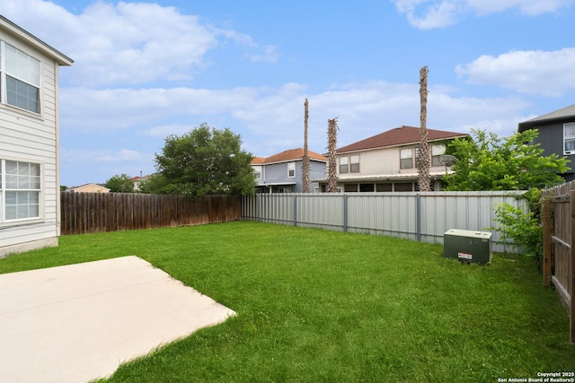 view of yard with a patio and a fenced backyard