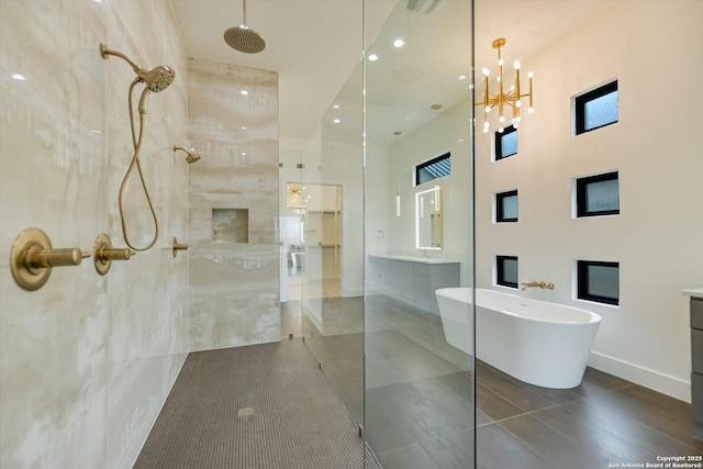 130 Azalea Loop, Horseshoe Bay, TX 78657 - full bath featuring tile patterned floors, vanity, walk in shower, and a freestanding tub