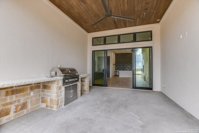 130 Azalea Loop, Horseshoe Bay, TX 78657 - view of patio featuring grilling area, an outdoor kitchen, and a ceiling fan