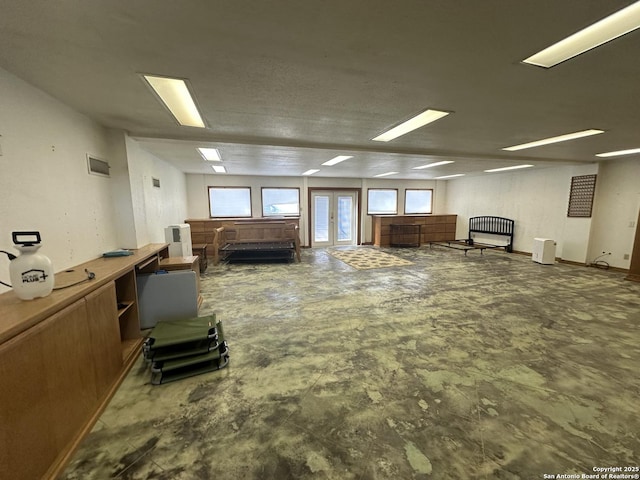 misc room with concrete floors