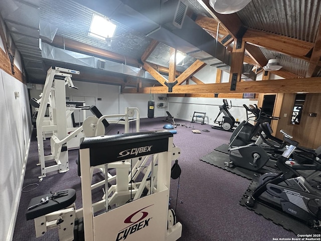 gym featuring lofted ceiling