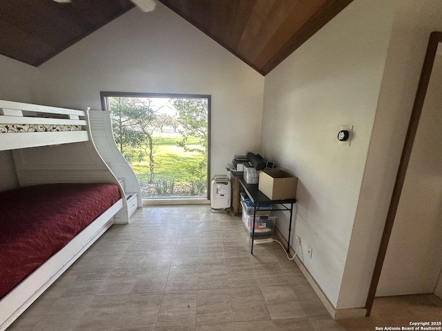 bedroom with high vaulted ceiling