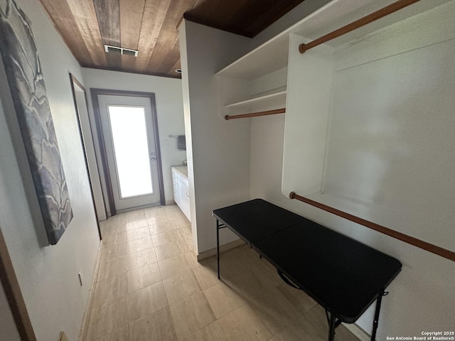 interior space with wood ceiling and visible vents