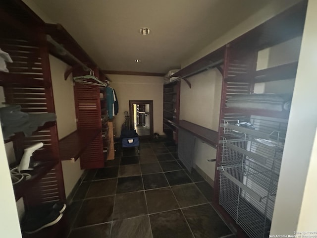 hall with dark tile patterned floors