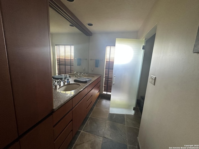 bathroom with double vanity and a sink