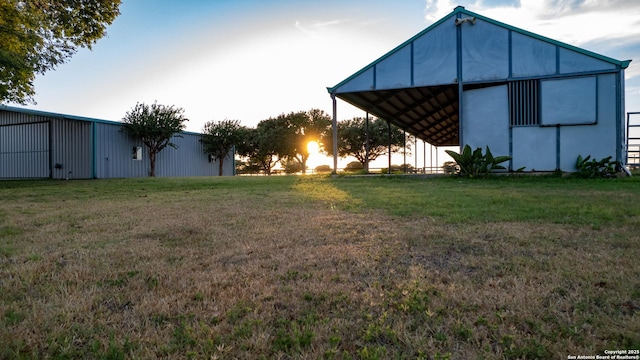 view of yard with an outbuilding and a pole building