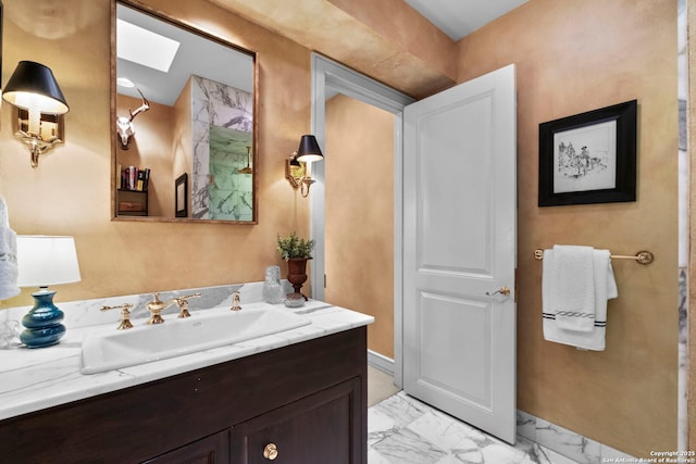 122 Chester Apt 5, San Antonio, TX 78209 - bathroom featuring a skylight, vanity, and marble look tile flooring