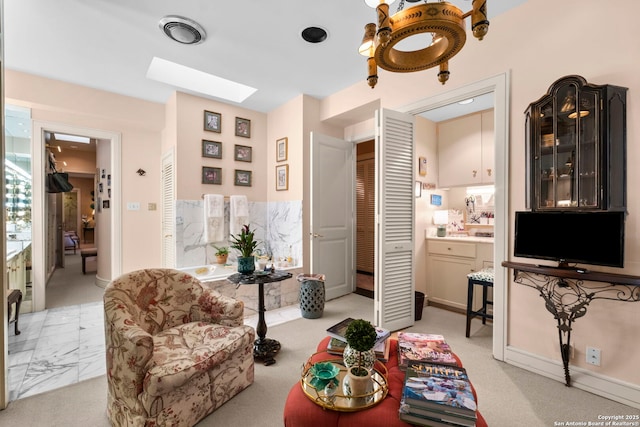 122 Chester Apt 5, San Antonio, TX 78209 - living area featuring a skylight and baseboards