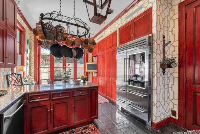 122 Chester Apt 5, San Antonio, TX 78209 - kitchen with stainless steel appliances, reddish brown cabinets, and a peninsula
