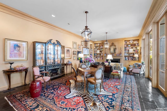 122 Chester Apt 5, San Antonio, TX 78209 - dining space with a fireplace, built in features, crown molding, and recessed lighting