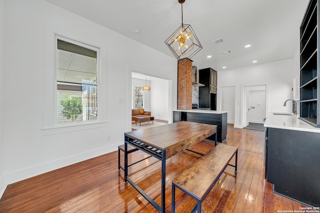 dining space with recessed lighting, visible vents, light wood finished floors, and baseboards