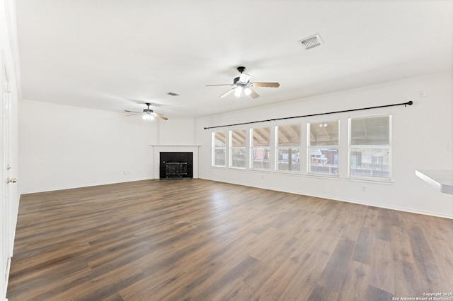 12319 Stable Road Dr, San Antonio, TX 78249 - unfurnished living room with visible vents, wood finished floors, a fireplace, and a ceiling fan