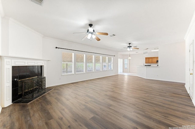 12319 Stable Road Dr, San Antonio, TX 78249 - unfurnished living room featuring visible vents, dark wood-type flooring, ceiling fan, crown molding, and a fireplace