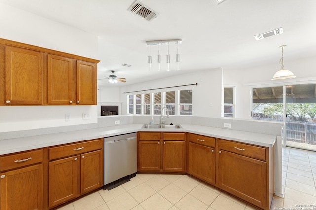 12319 Stable Road Dr, San Antonio, TX 78249 - kitchen featuring dishwasher, brown cabinets, visible vents, and a sink