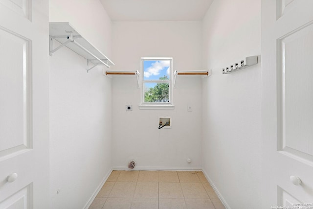 12319 Stable Road Dr, San Antonio, TX 78249 - washroom featuring baseboards, hookup for an electric dryer, hookup for a washing machine, and laundry area