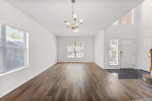 12319 Stable Road Dr, San Antonio, TX 78249 - entrance foyer featuring baseboards, wood finished floors, a chandelier, and a towering ceiling
