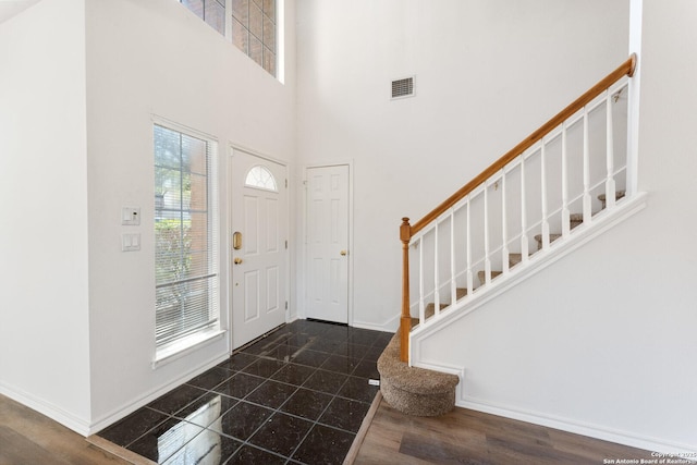 12319 Stable Road Dr, San Antonio, TX 78249 - foyer featuring visible vents, stairway, a high ceiling, baseboards, and dark wood-style flooring