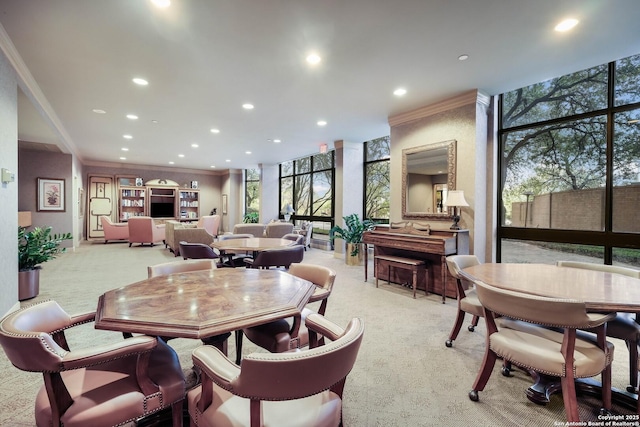 7887 Broadway Unit 707, San Antonio, TX 78209 - dining area featuring recessed lighting, light carpet, a wall of windows, and crown molding