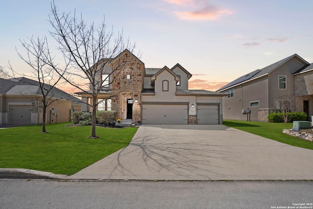 8010 Cibolo Vw, Boerne, TX 78015 - traditional home with a yard, central AC, driveway, and stone siding