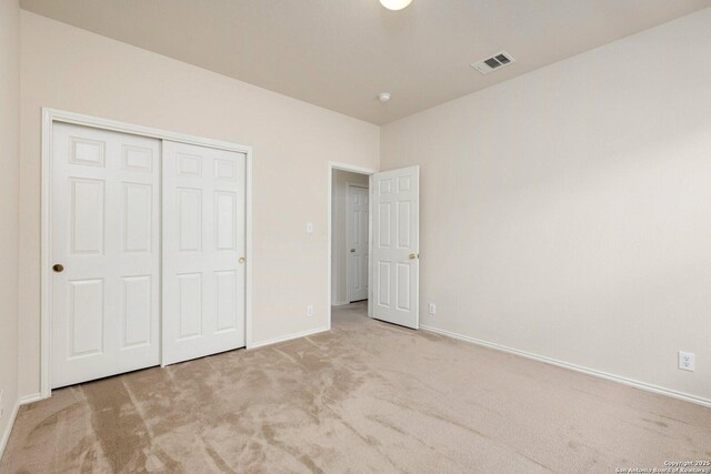 14204 Auberry, Helotes, TX 78023 - unfurnished bedroom featuring carpet floors, baseboards, and a closet