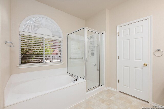 14204 Auberry, Helotes, TX 78023 - bathroom with a stall shower, a garden tub, and baseboards