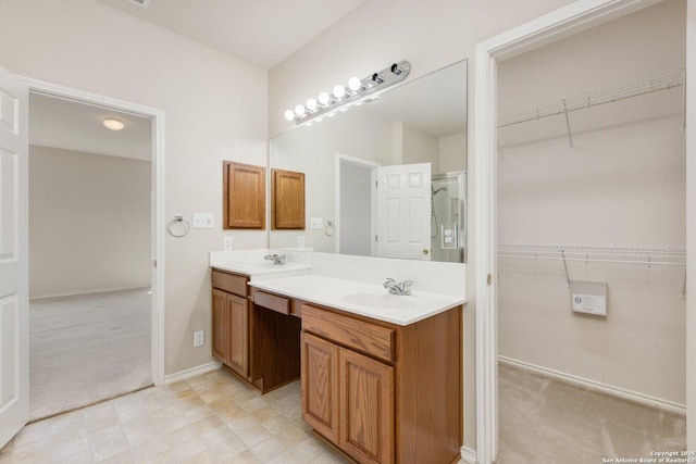 14204 Auberry, Helotes, TX 78023 - full bathroom with a walk in closet, double vanity, and baseboards