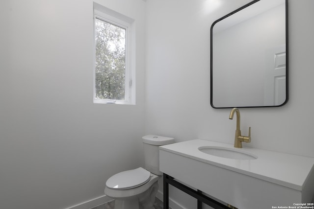106 Bank St Unit 201, San Antonio, TX 78204 - bathroom with toilet, vanity, and baseboards