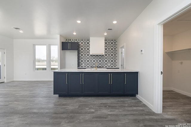 106 Bank St Unit 201, San Antonio, TX 78204 - kitchen with baseboards, visible vents, dark wood finished floors, recessed lighting, and light countertops