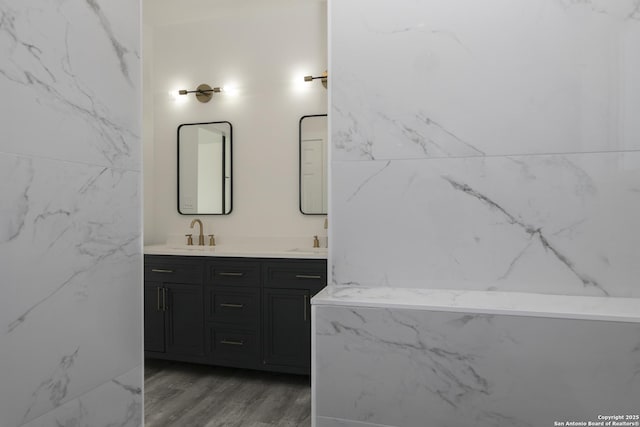 106 Bank St Unit 201, San Antonio, TX 78204 - full bath featuring double vanity, wood finished floors, and a sink