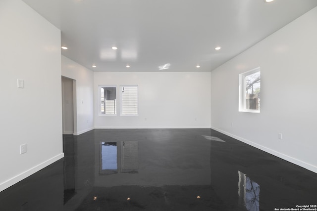 106 Bank St Unit 201, San Antonio, TX 78204 - spare room with a wealth of natural light, finished concrete floors, recessed lighting, and baseboards