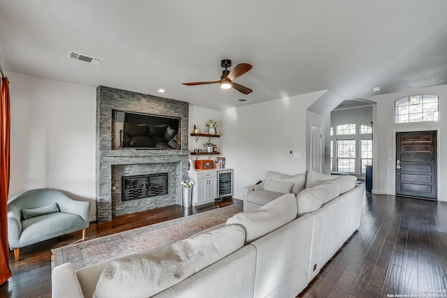 15110 Grayoak Frst, San Antonio, TX 78248 - living area with ceiling fan, visible vents, dark wood-style floors, and beverage cooler