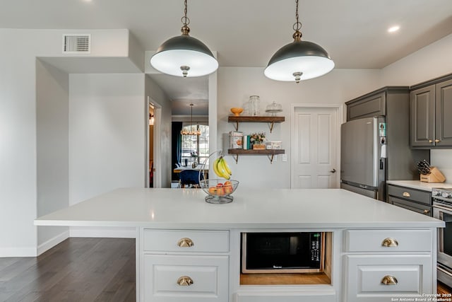 15110 Grayoak Frst, San Antonio, TX 78248 - kitchen featuring visible vents, light countertops, gray cabinets, appliances with stainless steel finishes, and dark wood-style flooring