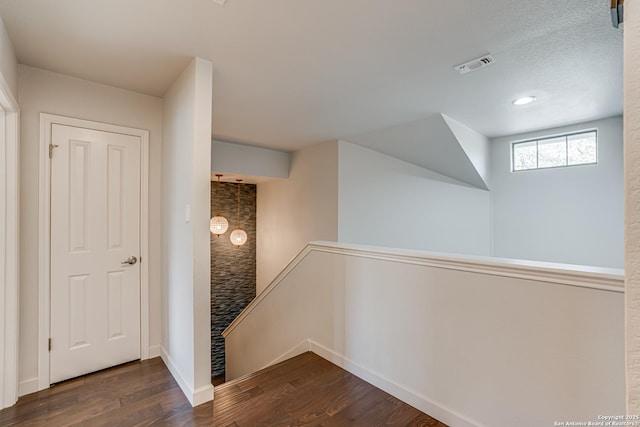 15110 Grayoak Frst, San Antonio, TX 78248 - hall featuring visible vents, an upstairs landing, baseboards, and wood finished floors