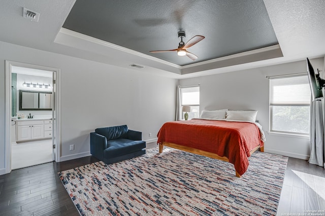 15110 Grayoak Frst, San Antonio, TX 78248 - bedroom with a raised ceiling, wood finished floors, visible vents, and a textured ceiling