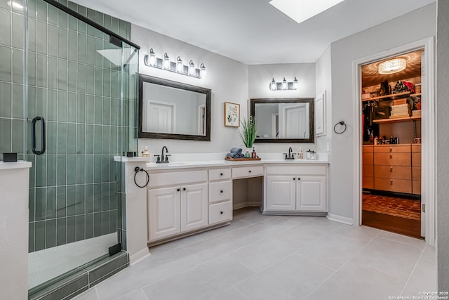 15110 Grayoak Frst, San Antonio, TX 78248 - full bath with double vanity, a skylight, a tile shower, and a sink