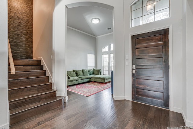 15110 Grayoak Frst, San Antonio, TX 78248 - entryway featuring visible vents, arched walkways, dark wood-style flooring, stairs, and crown molding