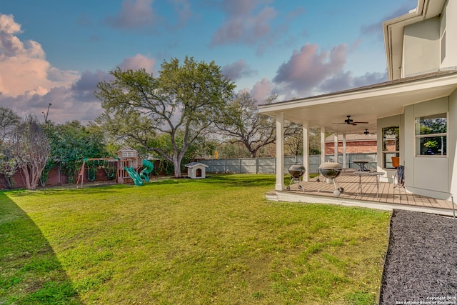 15110 Grayoak Frst, San Antonio, TX 78248 - view of yard featuring a ceiling fan, a playground, and a fenced backyard