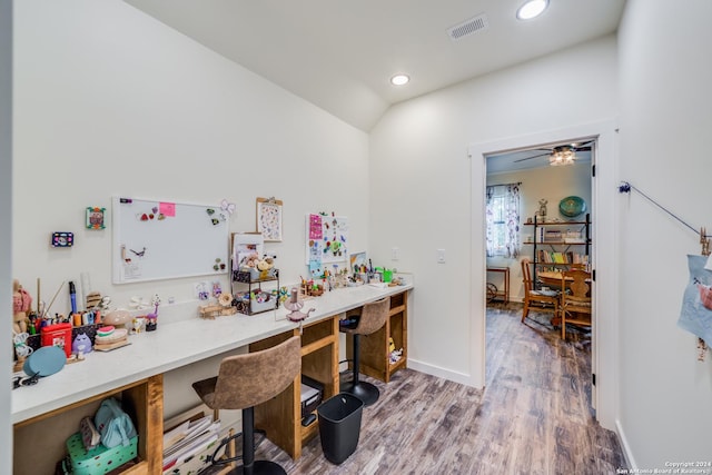 office with visible vents, wood finished floors, recessed lighting, baseboards, and vaulted ceiling