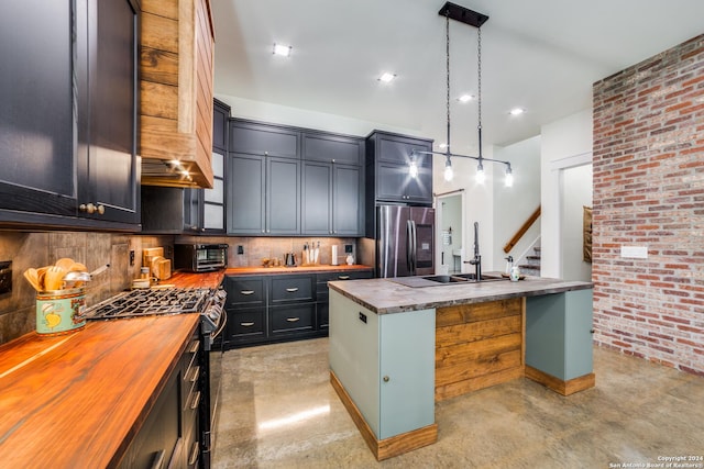 kitchen featuring gas stove, finished concrete floors, a sink, smart refrigerator, and butcher block counters